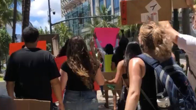 people marching with signs