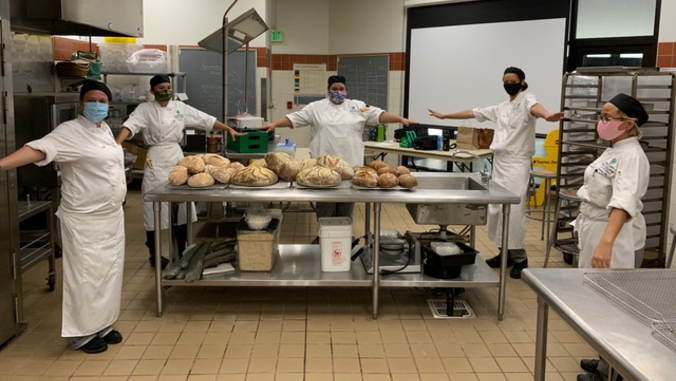 student bakers with bread