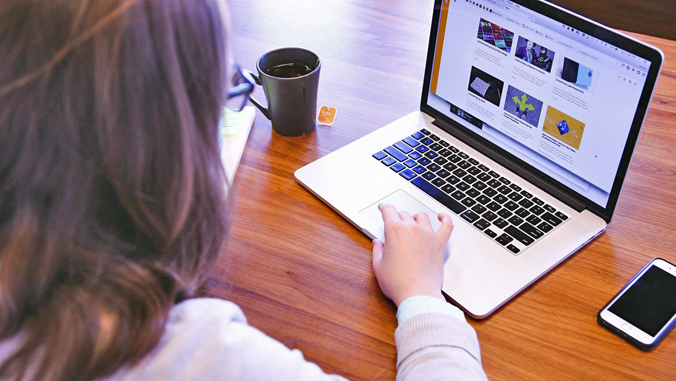 woman looking at laptop