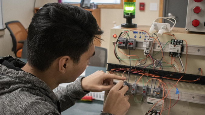 student working on panel
