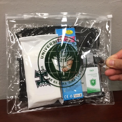 kit with masks wipes thermometer and hand sanitizer