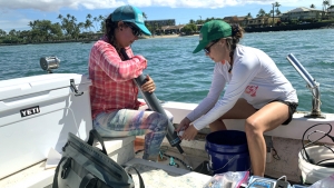 2 researchers on a boat