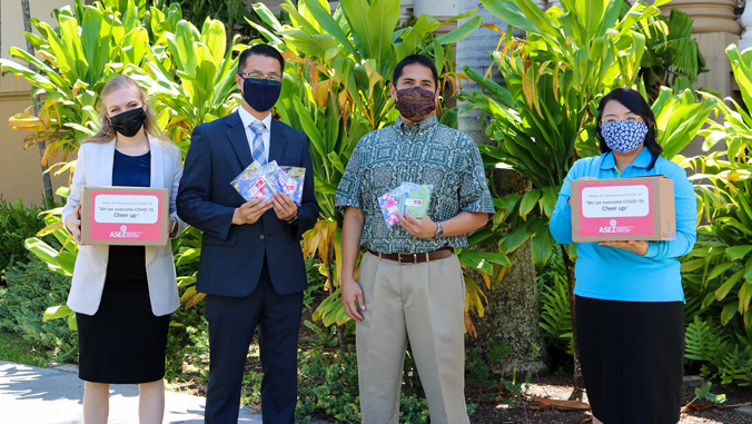 Students with masks and boxes