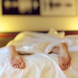 feet under bedsheets