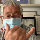 Gesture, then throw a shaka to encourage mask use