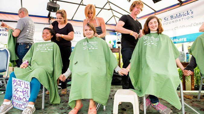people shaving their heads