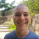 How does shaving heads help pediatric cancer research?
