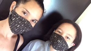Mikala Maynard with daughter wearing mask