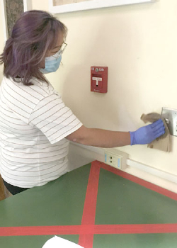 student disinfecting switch