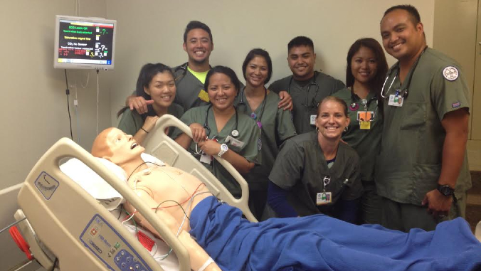 nursing students with mannequin