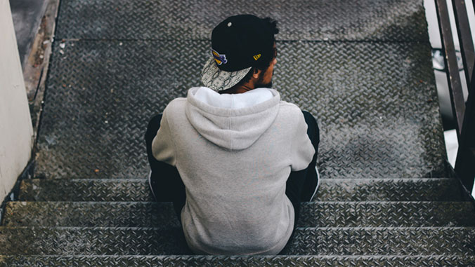 youth sitting on steps