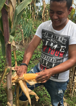 man holding corn
