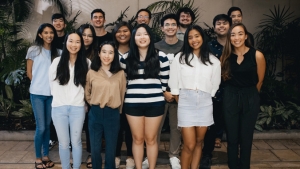 15 people smiling at camera