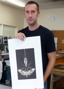 man holding print