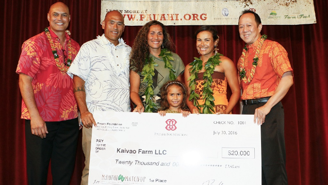 people holding giant check