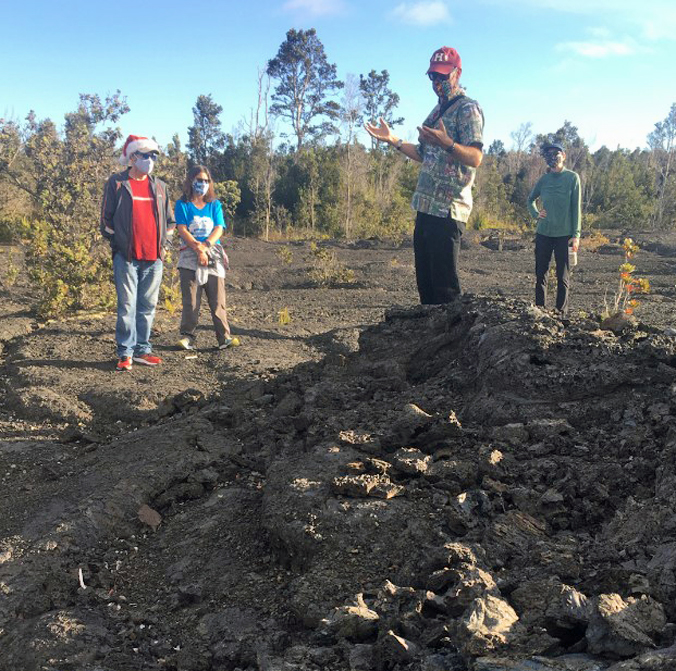 person explaining tree formation at Kilauea