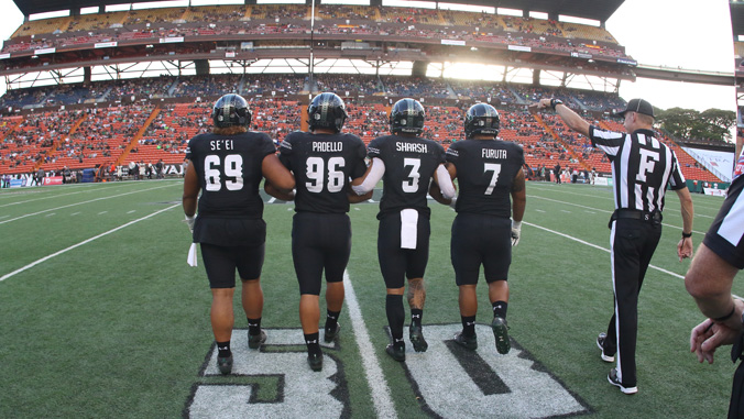 Football players at Aloha Stadium