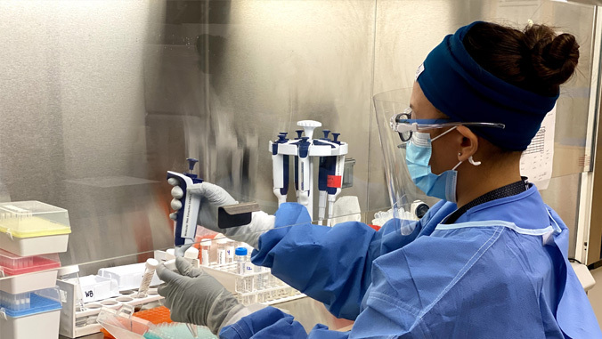 laboratory staff processing covid tests