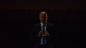 man in a suit and tie looking at the camera