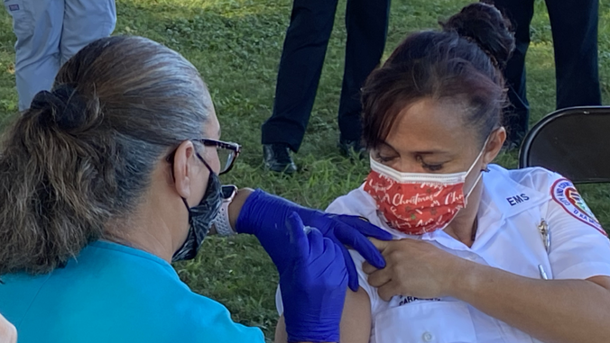 paramedic receives vaccine