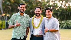 three people smiling at camera