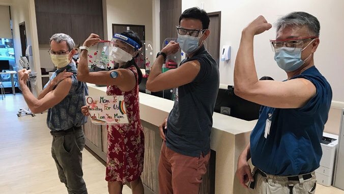 uh doctors flex vaccinated arms
