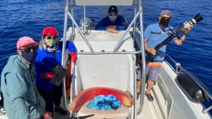 four people on a boat