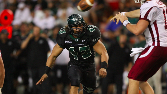 football player looking at the quarterback 