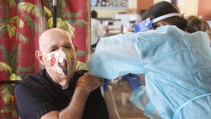 bishop larry silva getting covid vaccine