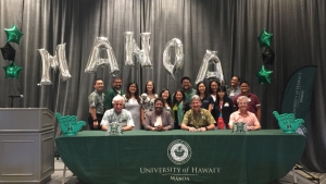 people sitting at a table smiling