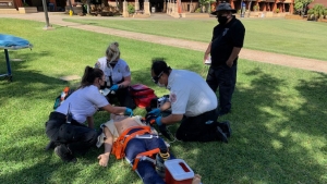 Students training with a patient simulation