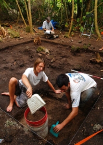 people digging in dirt doing excavation work