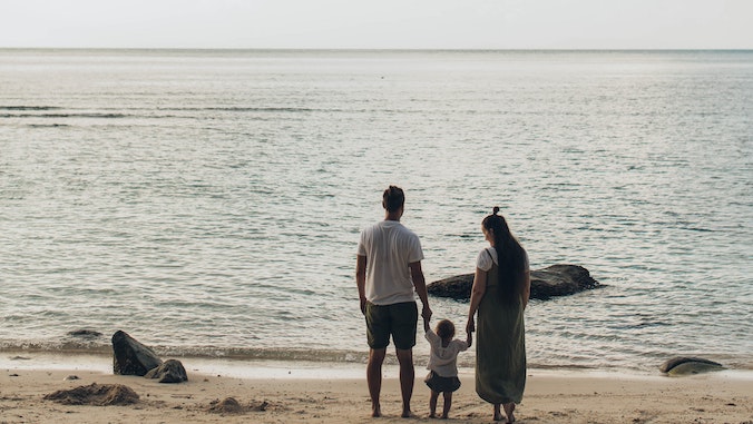 family looking at the beach