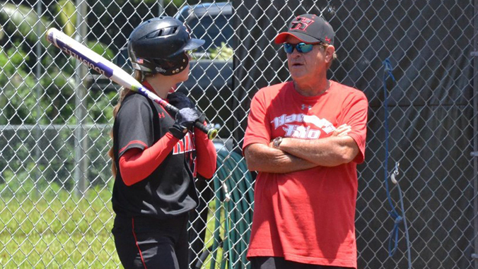 U H Hilo softball player and coach