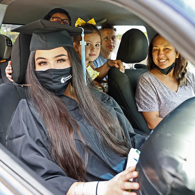 graduate in her car