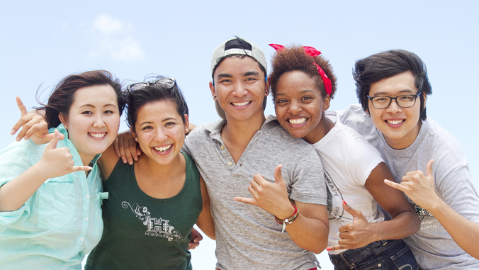 five people smiling at the camera