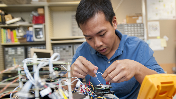 person working on wiring