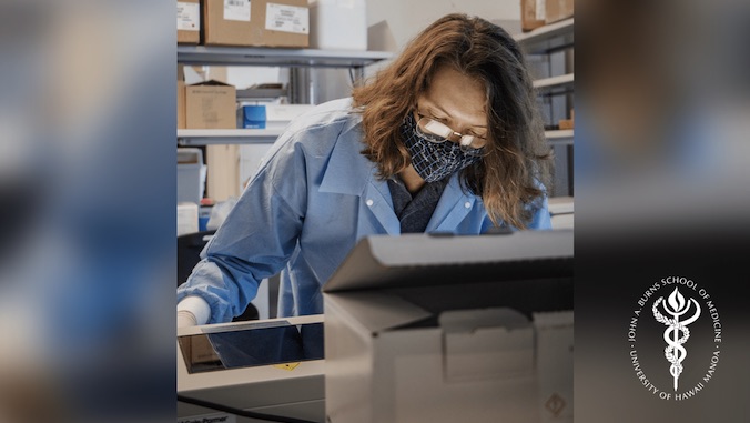 lab technician looking at screen