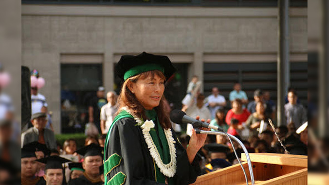 woman speaking at commencement