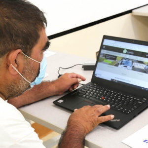 man sitting in front of computer