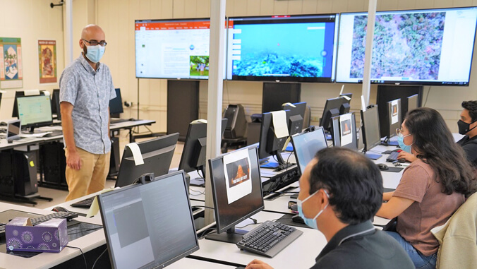 teacher and students in computer science class