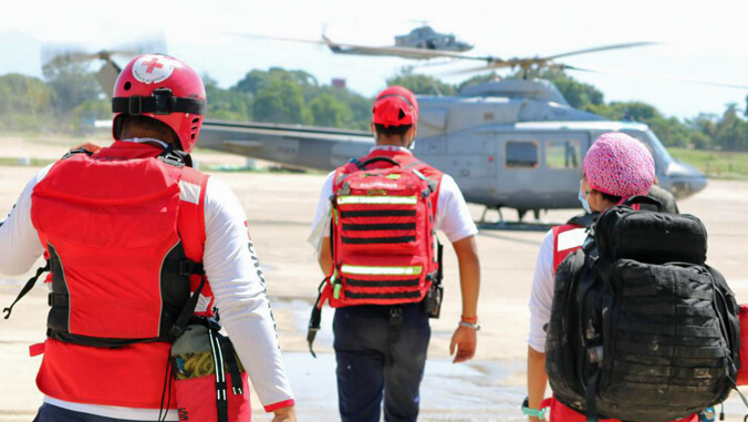Red Cross workers headed to helicopter