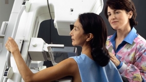 technician and patient at imaging machine