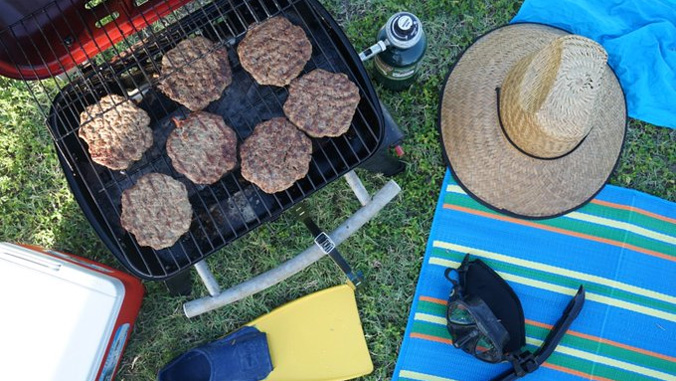 Burgers on a grill outside