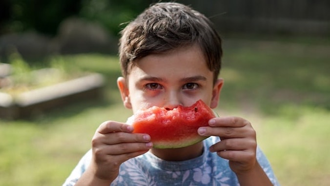boy eating watermelon