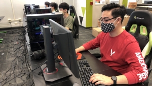 person sitting at a computer