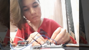Woman working on electronics
