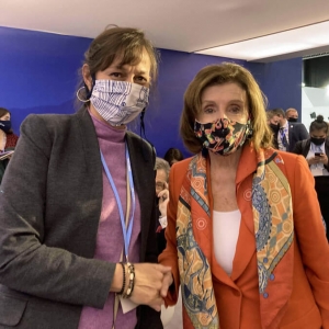 Karides and Pelosi shaking hands