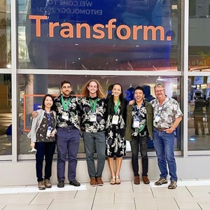 group photo in front of Transform. sign
