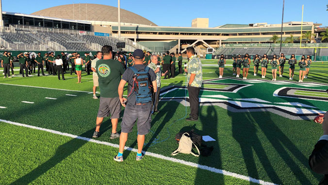 on the football field filming